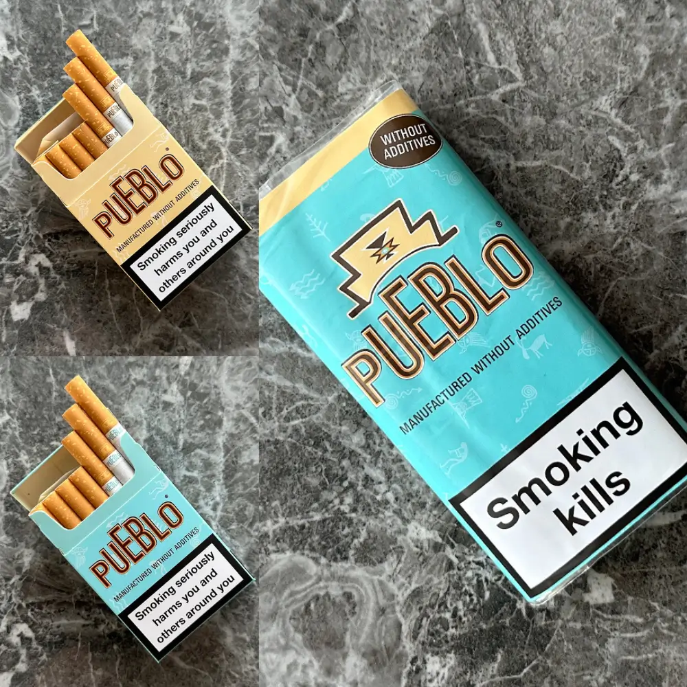 Pueblo Zigarettenpackung mit orangefarbenen Zigaretten, etikettiert mit „Ohne Zusatzstoffe“ und Warnhinweis „Rauchen tötet“, auf marmoriertem Hintergrund.
