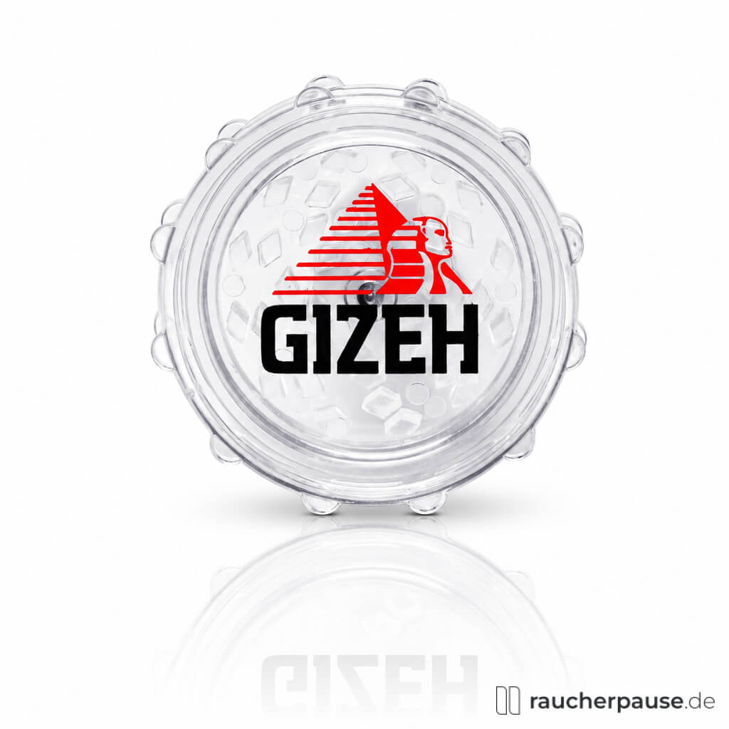 Transparente runde Dose mit glatter Oberfläche und modernem Logo in Rot und Schwarz, zeigt eine Pyramide und ein Gesicht, Gizeh Grinder Kunststoff Mix 60 mm.